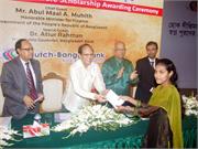 BB Governor hands a cheque to a student on Dutch-Bangla Bank´s Scholarship Awarding ceremony held in the city.