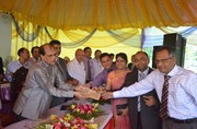 Honorable Governor Dr. Atiur Rahman disbursing SME loan to a small entrepreneur in "Bank-NASCIB SME Saikat Utshab-2011" at Cox´s Bazar on 11th November 2011