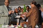 A local Businessman of Cox´s Bazar presenting a betel leaf plant to Honorable Governor Dr. Atiur Rahman
