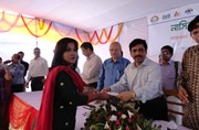 E.D.Chowdhury  Mohidul Haque disbursing SME loan to a small women entrepreneur in Rangamati NASCIB SME festival, 2011