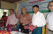 General Manager of SME & SPD Sukamal Sinha Choudhury launching a book related to SME development in Rangamati