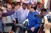 BB Governor Dr. Atiur Rahman hands SME Investment of Islami Bank Bangladesh Limited to a Entrepreneur at Dahalakhagrabari of Debigong a former Enclave.