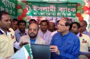 BB Governor Dr. Atiur Rahman hands SME Investment of Islami Bank Bangladesh Limited to a Entrepreneur at Dahalakhagrabari of Debigong a former Enclave.